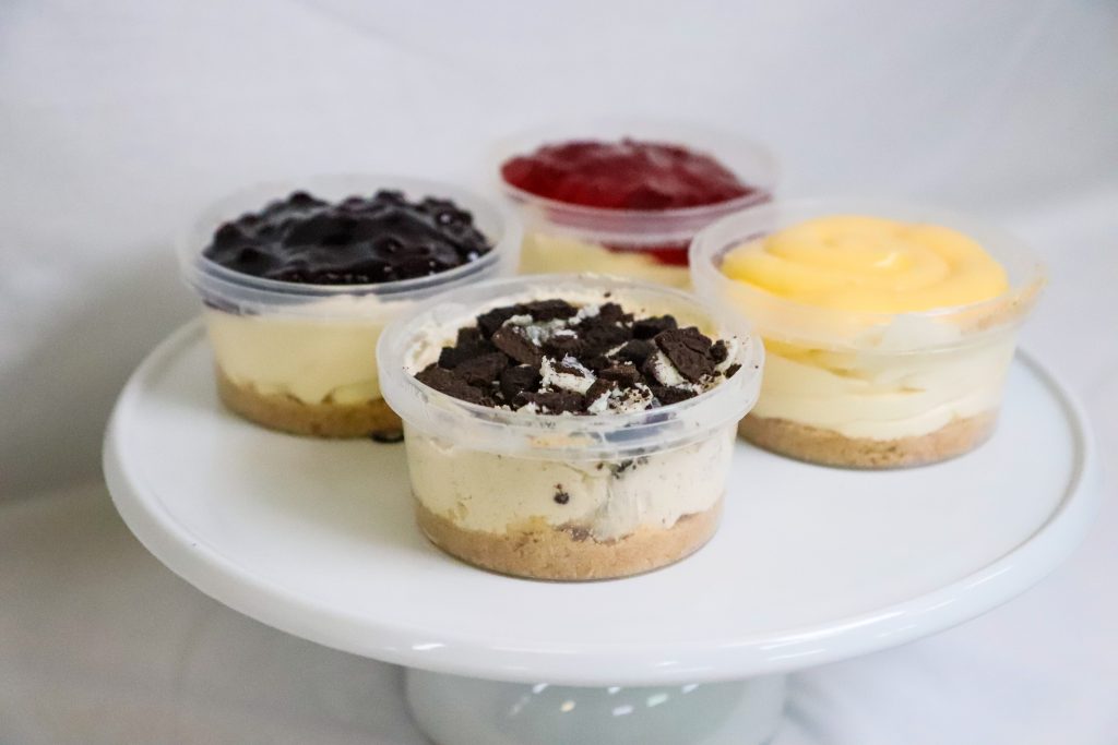 Individual cheesecake Cup topped with crushed oreo cookies