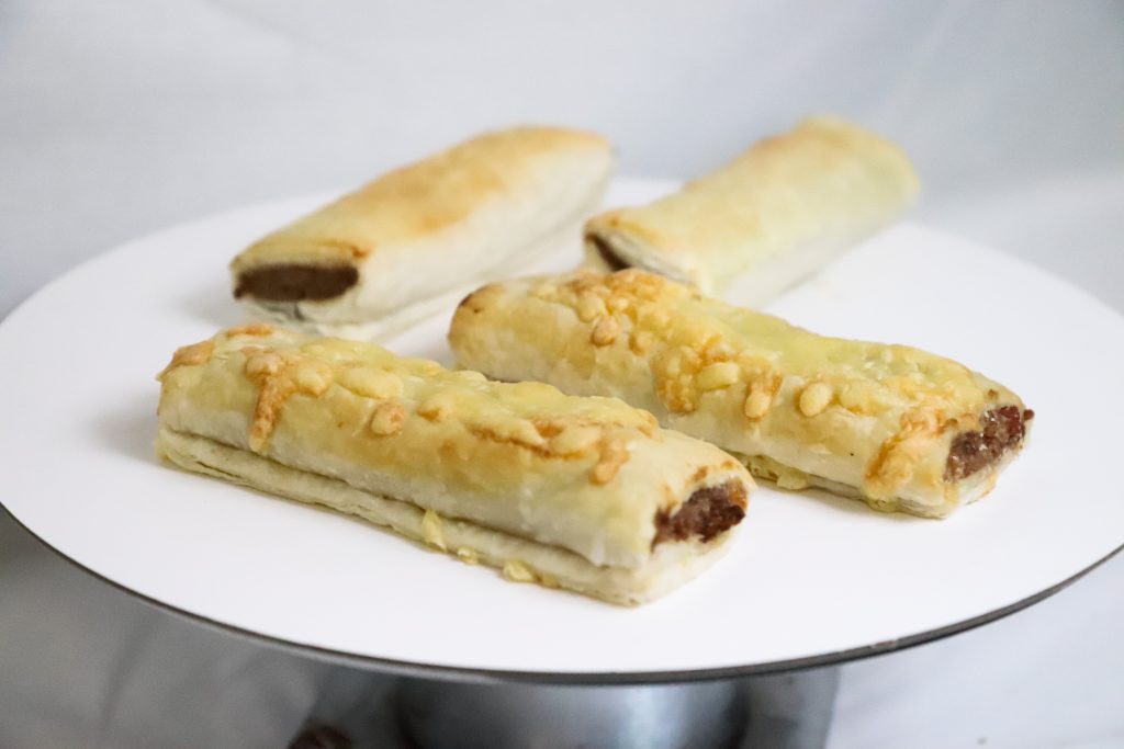 Fresh individual beef sausage roll with bacon and cheese