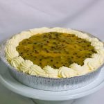 Fresh Chilled Cheesecake topped with passionfruit and fresh cream