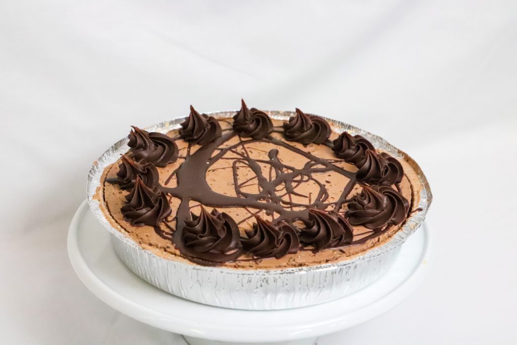 Fresh Chilled Chocolate Cheesecake topped with a chocolate ganache