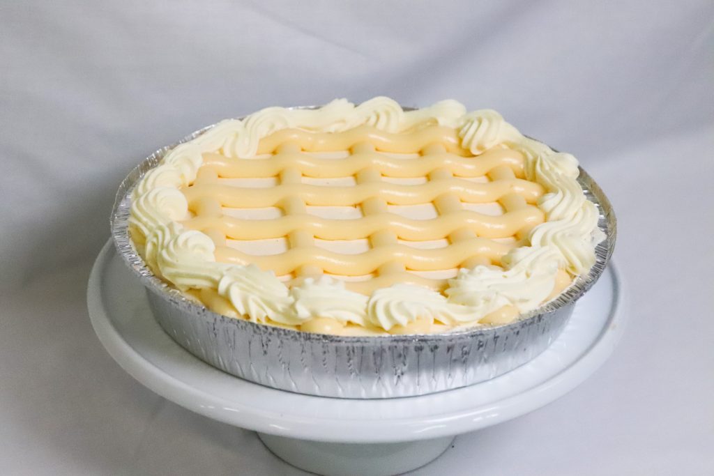 Fresh Chilled Cheesecake topped with lemon curd and fresh cream