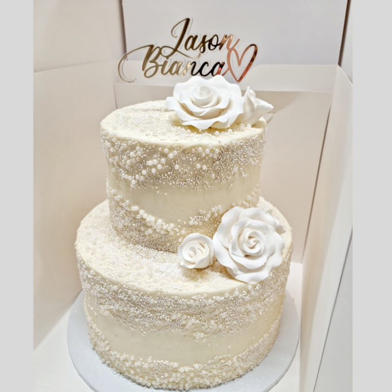 2 tier 2 stacked mudcakes with pearl sprinkles and white roses