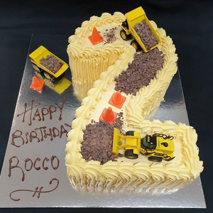 number 2 cake with dump trucks, bob cats and diggers