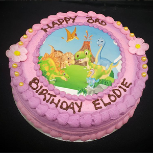 girl's dinosaur cake for a kids birthday party