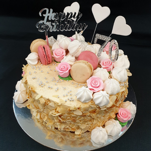 caramel gateaux with macaroons and flowers
