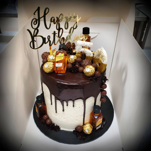 birthday cake with chocolate drip and chocolates
