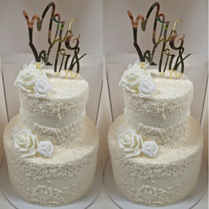 2 tier stacked wedding cake with pearls and white roses